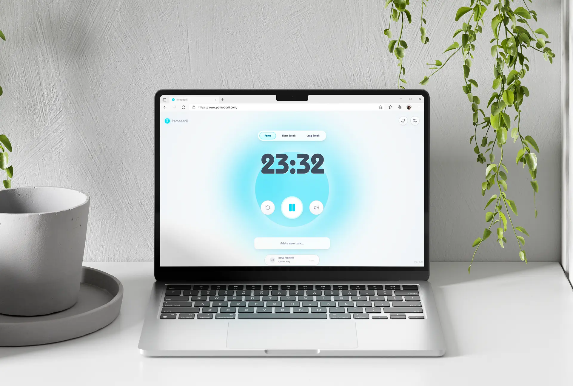 Pomodorii timer app running on a laptop beside plants
